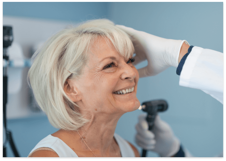 a woman getting tinnitus treatment